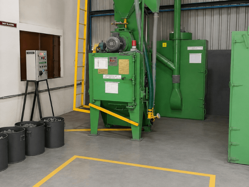 Shot blasting cabinet with cast components on the finishing line