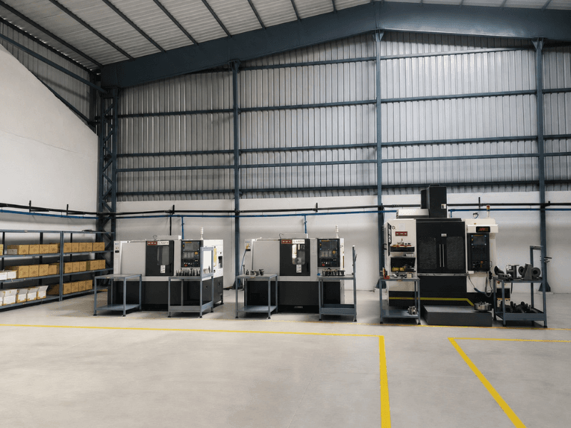 Precimetal machine shop bay with CNC turning centres and a vertical machining centre